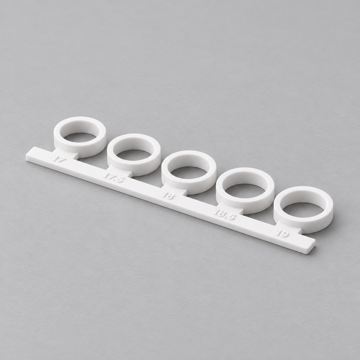 Ring sizing strip with five custom inside diameters – AI product visualization