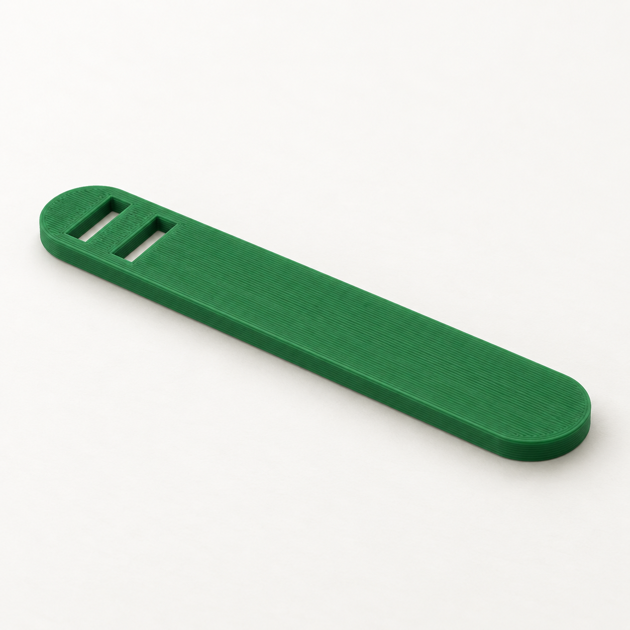 Passe-élastique à deux fentes sur mesure – vert. Visualisation IA des dimensions par défaut.