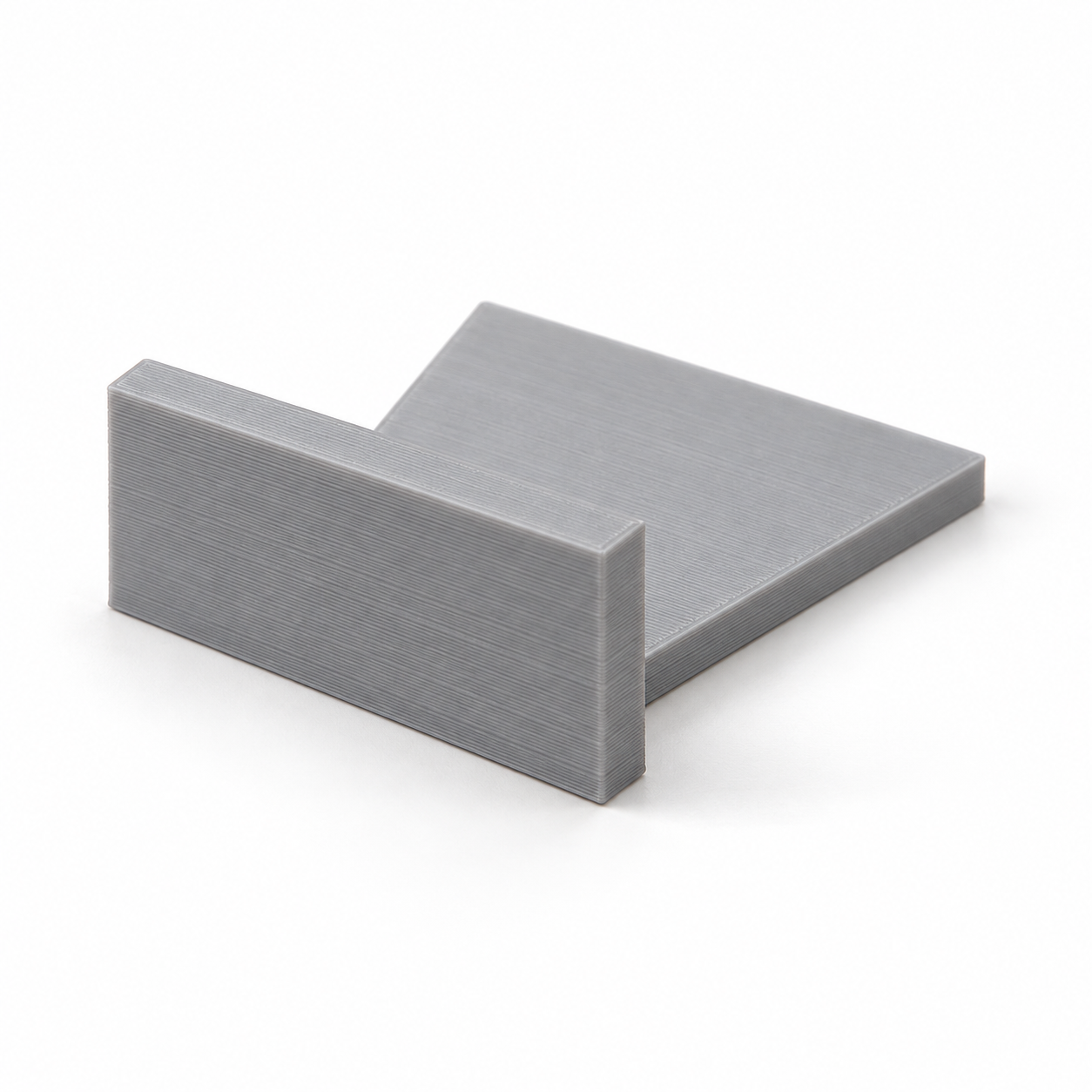 Plaque trapézoïdale avec butée perpendiculaire. Visualisation IA des dimensions par défaut.